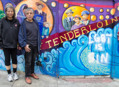 Hanmin Liu and Jennifer Mei standing by a mural that says "Tenderloin"