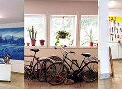 Image of a room with a group of bicycles together. 