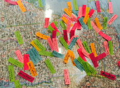 Close-up street map with various colorful papers on it