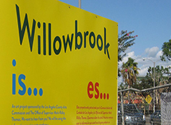 A yellow sign that says Willowbrook is...
