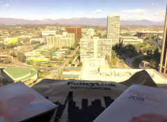 Landscape image of Los Angeles with papers on a desk