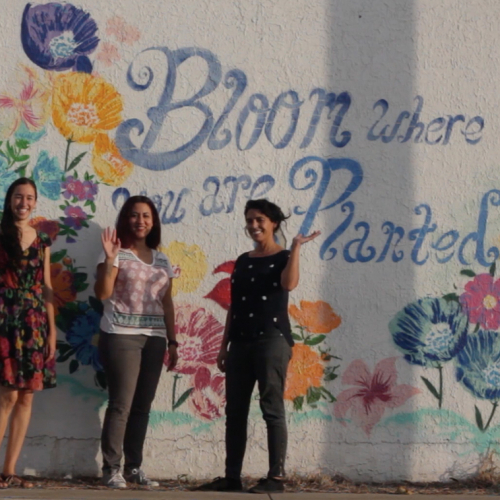 Artist Collective, Las Imaginistas, standing in front of local street art by Josue Ramirez (RAW) in Downtown Brownsville, Texas.